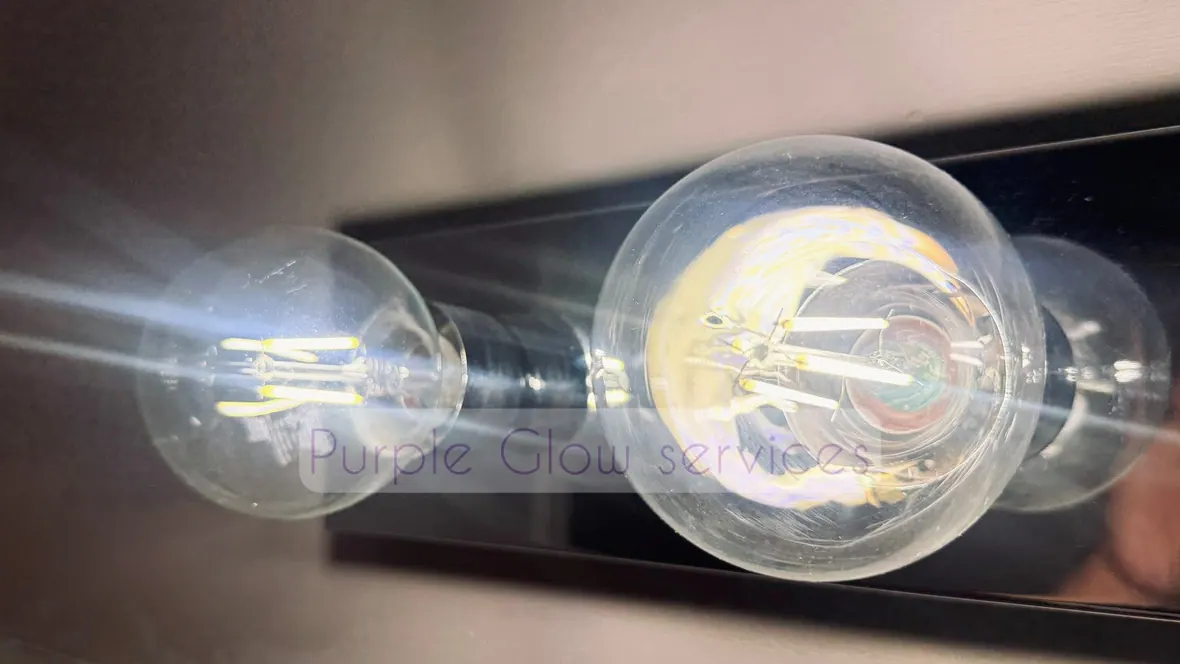 Before and after: dusty Edison bulbs wiped clear during a detail cleaning by Purple Glow Services