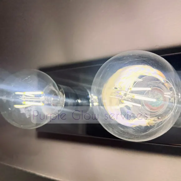 Before and after: dusty Edison bulbs wiped clear during a detail cleaning by Purple Glow Services