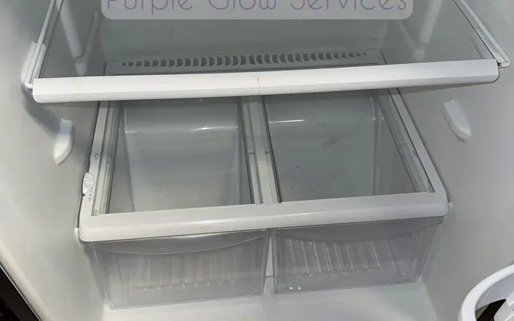 Empty refrigerator interior washed down with clean glass shelves during a move-out cleaning in Murfreesboro, TN
