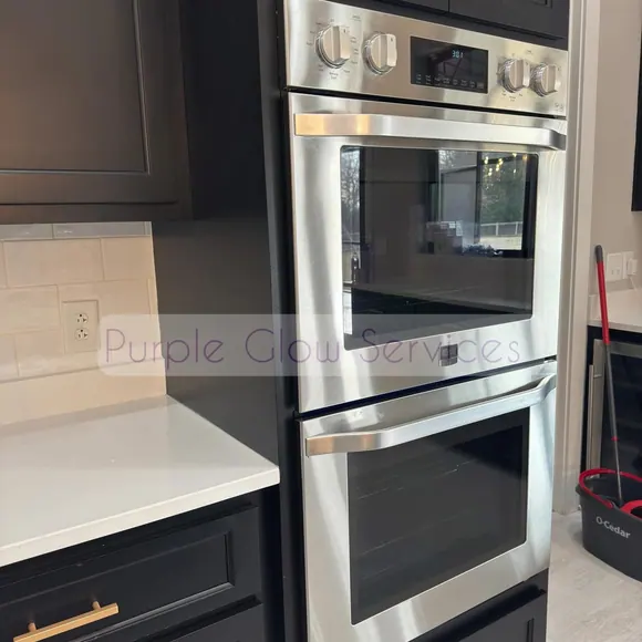 Stainless double wall oven and quartz countertop polished during a deep kitchen clean in Middle Tennessee
