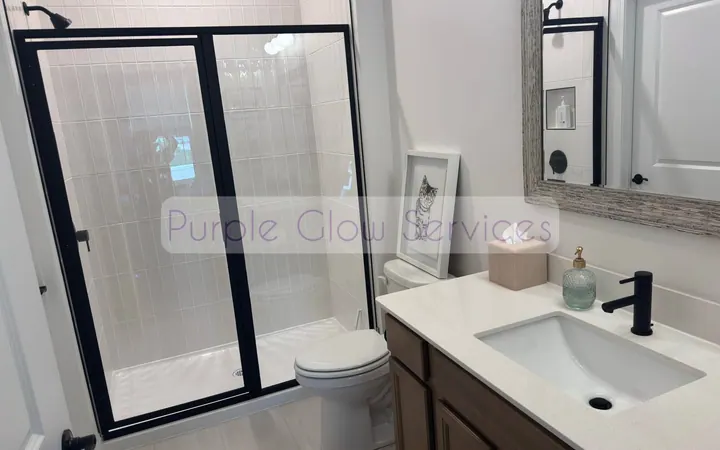 Clean bathroom with streak-free shower glass, mirror and vanity after a house cleaning in Smyrna, TN