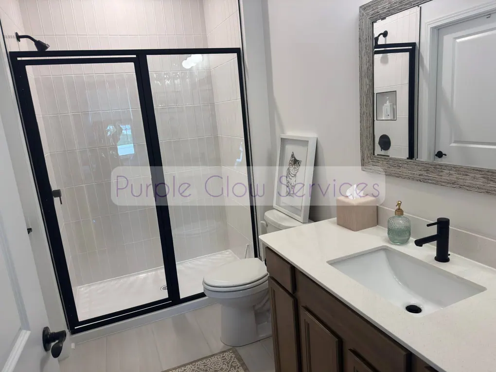 Clean bathroom with streak-free shower glass, mirror and vanity after a house cleaning in Smyrna, TN