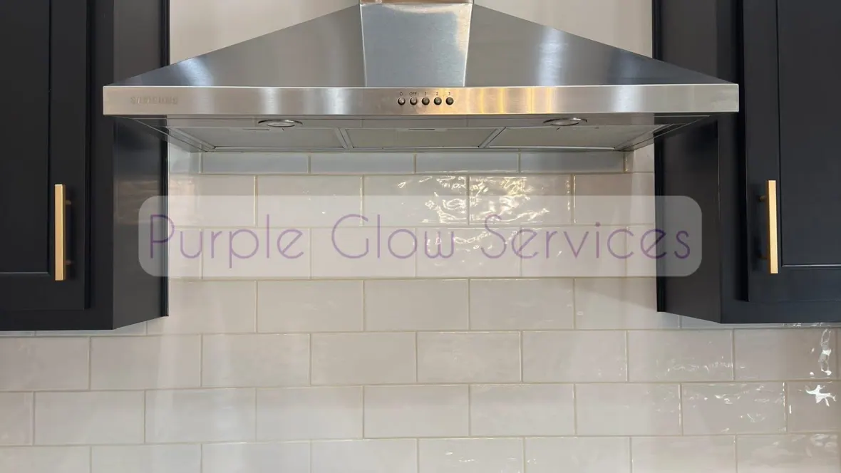 Stainless range hood, gas cooktop and white tile backsplash wiped down after a kitchen cleaning in Murfreesboro, TN